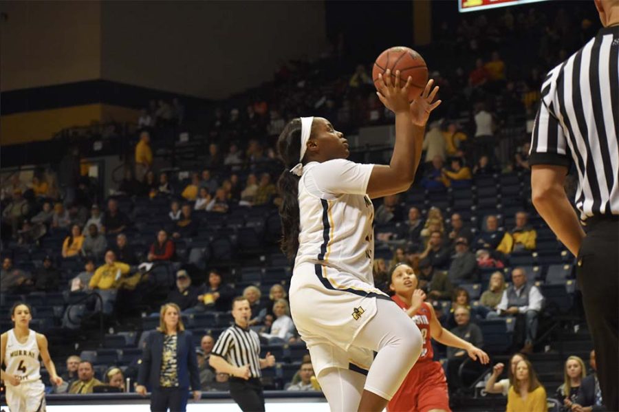 Junior forward Evelyn Adebayo lays the ball in against Austin Peay. (Photo by Gage Johnson/TheNews)