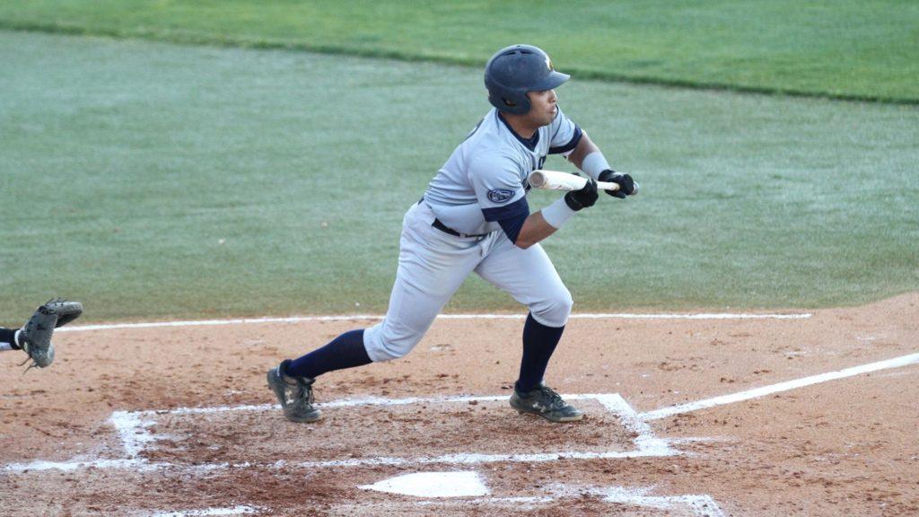 Sophomore Jordan Holly attempts to bunt the ball. (Photo by Racer Athletics)
