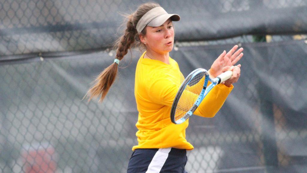 Junior Anja Loncarevic returns the ball in her singles match. (Photo by Dan Hasko/Racer Athletics)