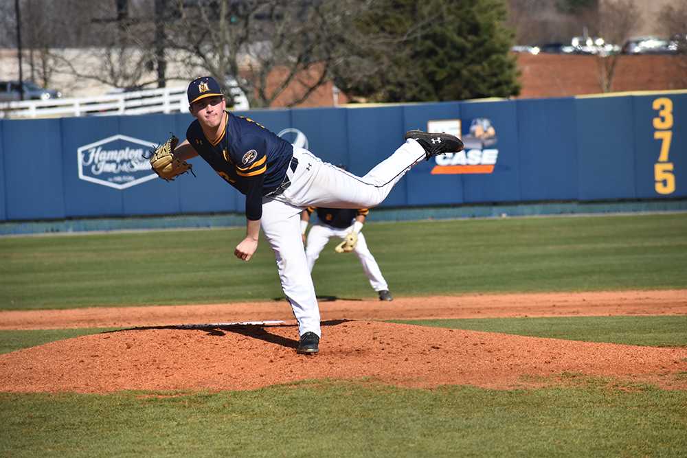 Freshman pitcher Shane Burns finishes his pitching motion. (Photo by Gage Johnson/TheNews)