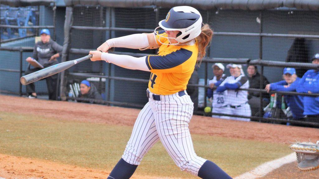 Senior infielder Brenna Finck connects for a hit against Jacksonville State. (Photo by Daryl Banther)