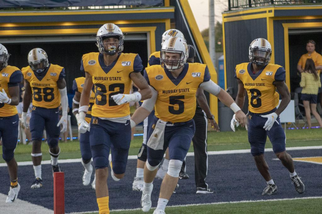 Murray State redshirt sophomore quarterback Preston Rice celebrates with his teammates after a touchdown. (Mackenzie O’Donley/TheNews)
