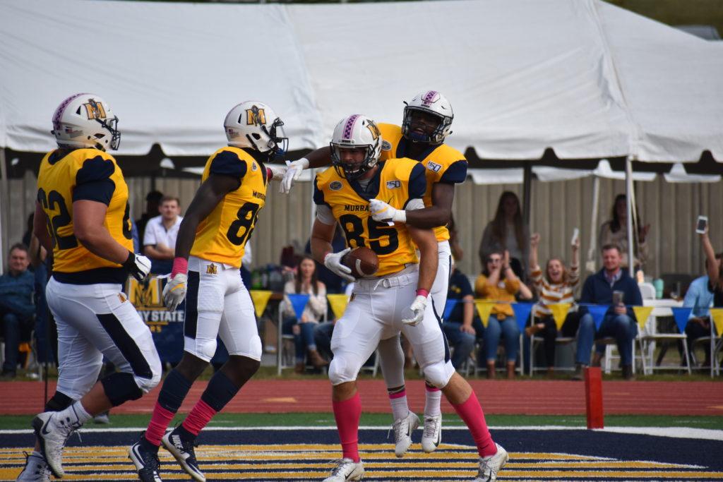 The+Racers+celebrate+after+James+Sappington+catches+the+ball+for+a+touchdown+during+Homecoming+Weekend.+%28Jillian+Rush%2FTheNews%29