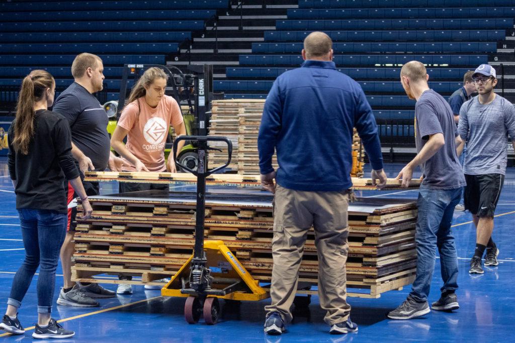 Students and faculty help assemble the new floor in the CFSB Center. (Photo by Kalea Anderson/TheNews)