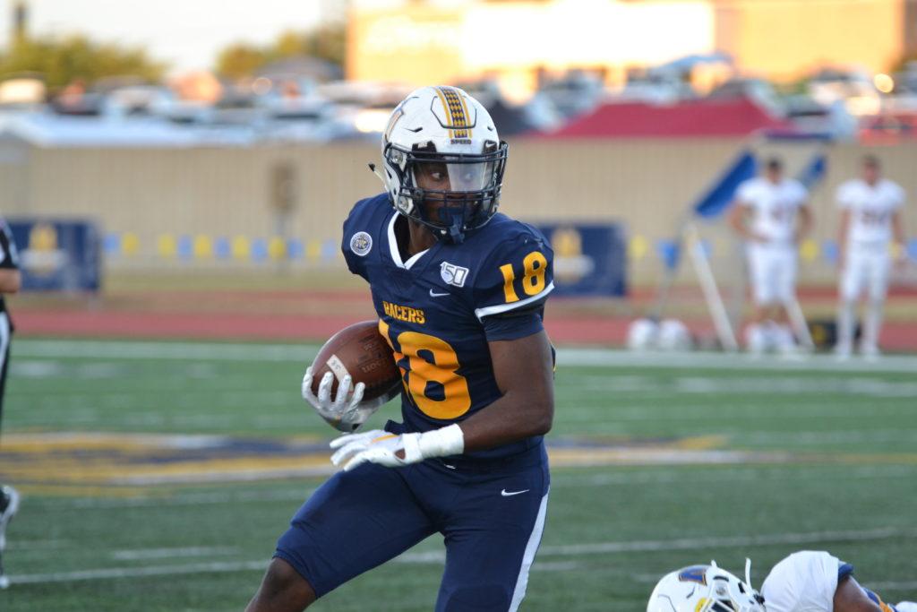 Junior running back Rodney Castille surveys the field while taking off toward the endzone. (Photo by Lauren Morgan/TheNews)