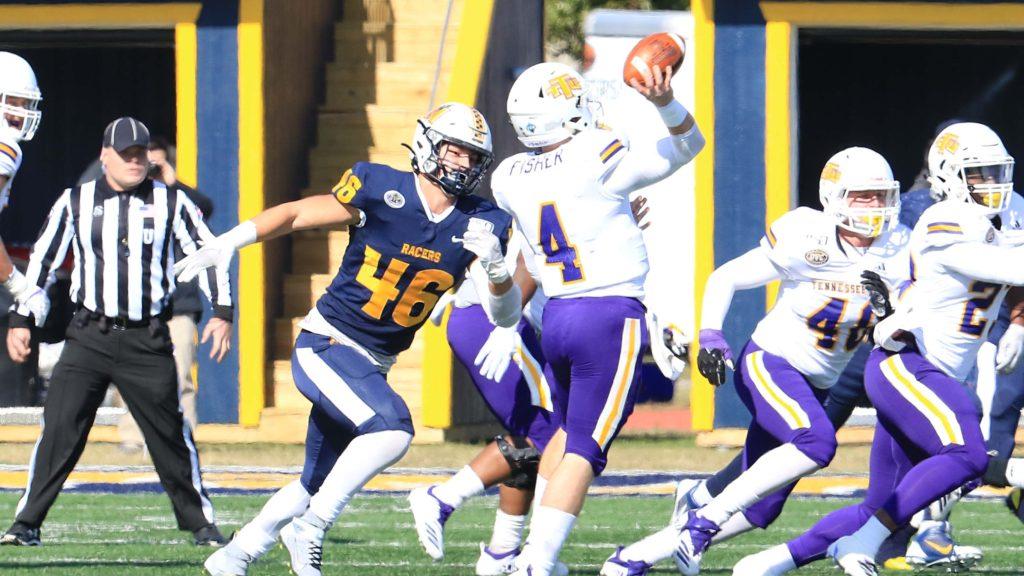 Scotty Humpich attempts to sack the Golden Eagles quarterback. (Photo courtesy of Racer Athletics)