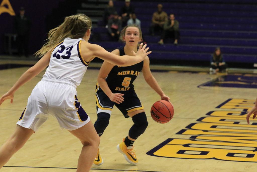 Sophomore guard Macey Turley checks the shot clock on offense. (Photo courtesy of Racer Athletics)