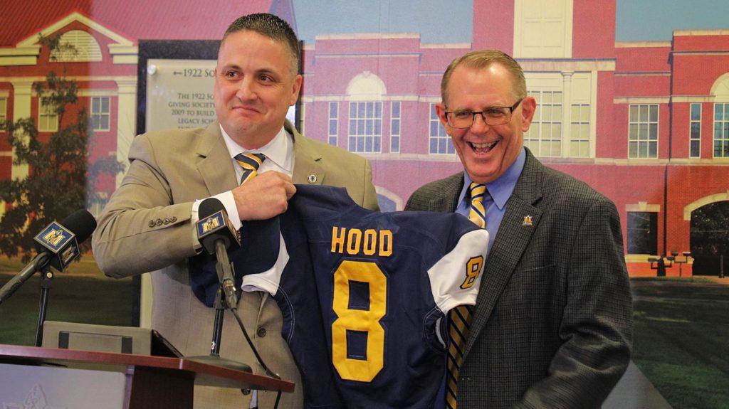 Murray State Athletic Director Kevin Saal introduces new head football coach Dean Hood with a jersey at the introductory press conference. (Photo courtesy of Racer Athletics)