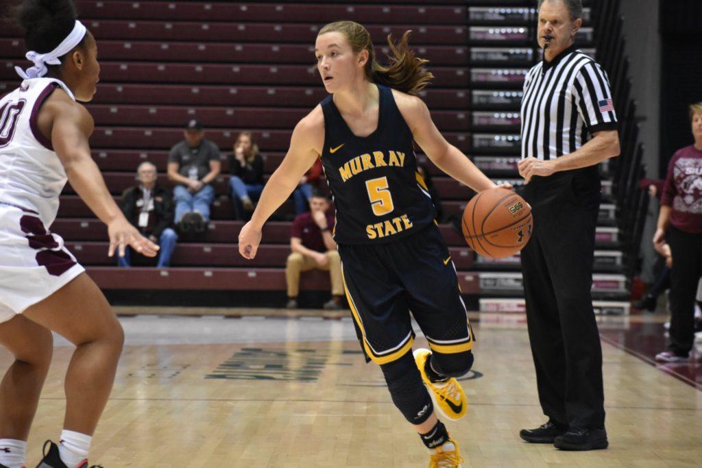 Sophomore+guard+Macey+Turley+does+a+hesitation+move+before+driving+baseline+against+SIU.+%28Photo+by+Gage+Johnson%2FTheNews%29