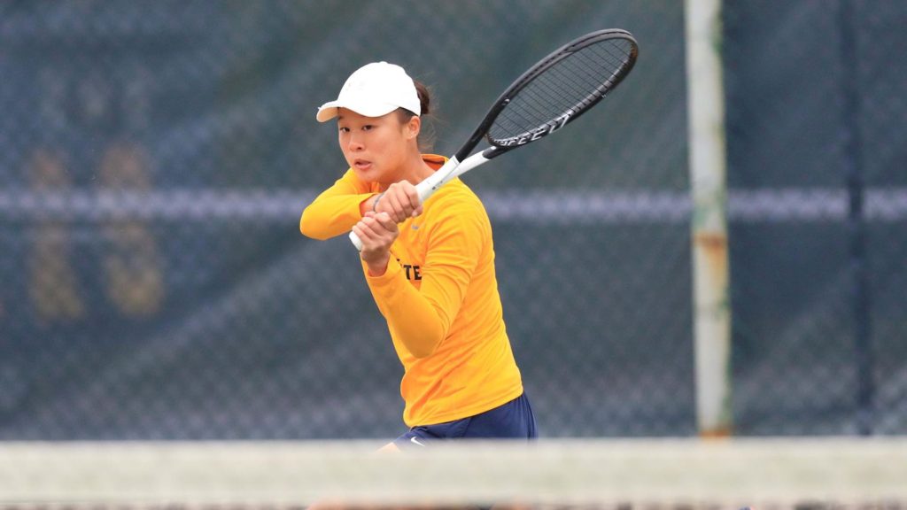 Senior Claire Chang watches the ball after returning it. (Photo courtesy of Racer Athletics)