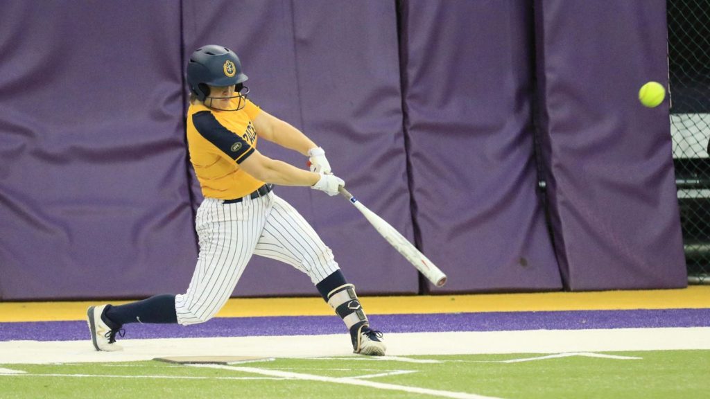 Senior+Lexi+Jones+infielder+hits+a+line+drive+into+the+outfield+at+the+Doc+Halverson+UNI-Dome+Classic.+%28Photo+courtesy+of+Racer+Athletics%29