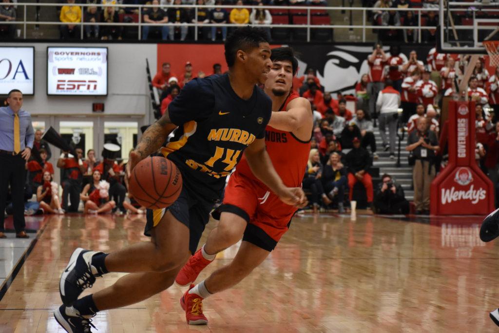 Senior guard Jaiveon Eaves drives to the basket against Austin Peay. (Photo courtesy of Racer Athletics)