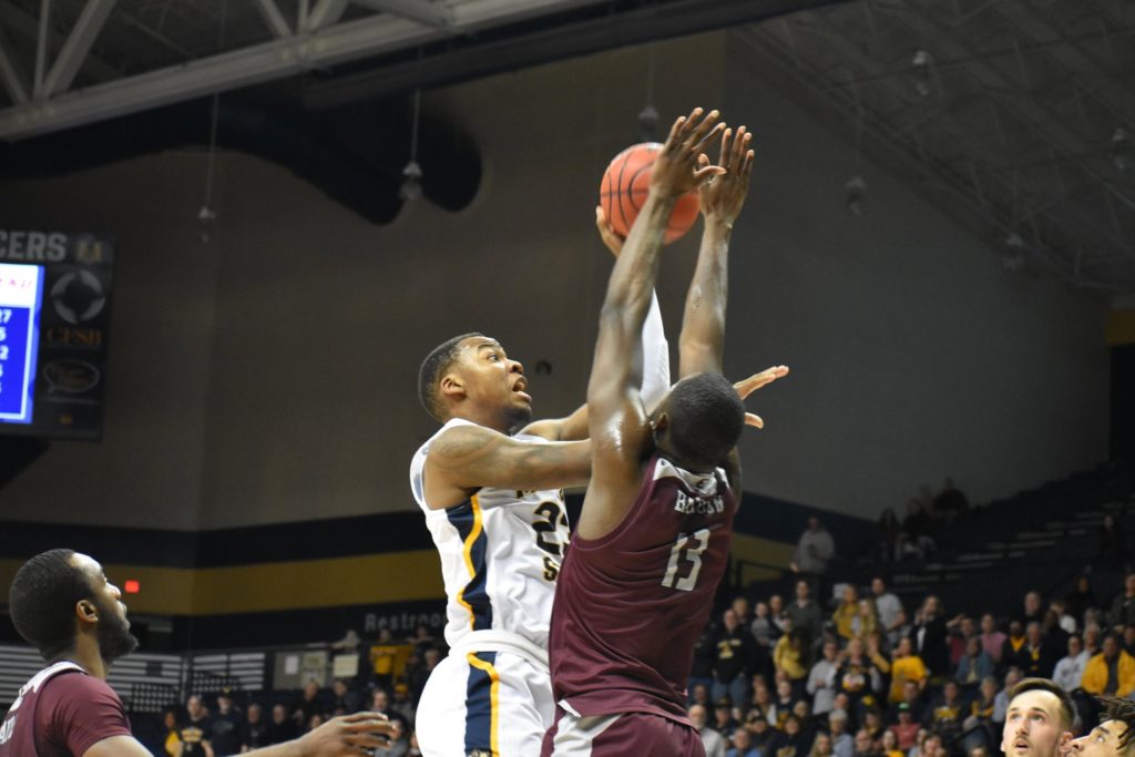 Sophomore+forward+KJ+Williams+attempts+a+contested+shot+against+EKU.+%28Photo+by+Gage+Johnson%2FThe+News%29