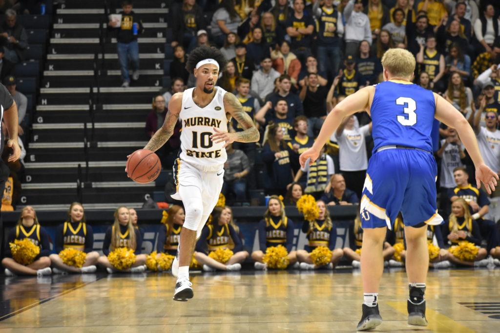 Sophomore guard Tevin Brown brings the ball up the court. (Photo by Gage Johnson/The News)