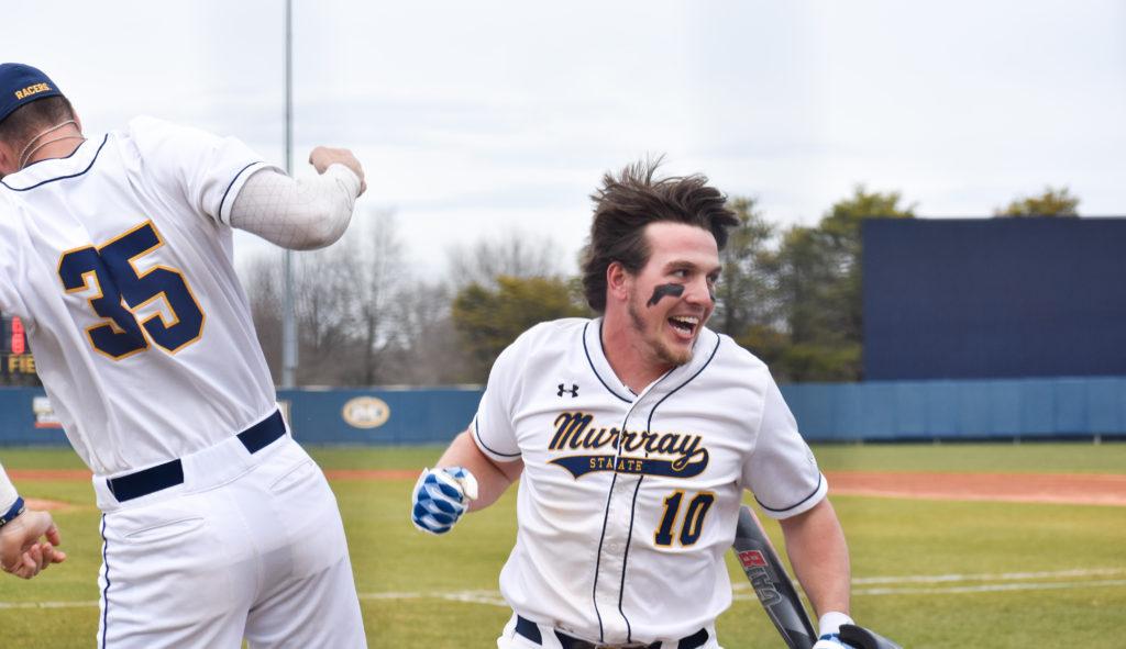 Senior outfielder Ryan Perkins celebrates with sophomore catcher Jonah Brannon in a game on March 1. (Photo by Paige Bold/TheNews)