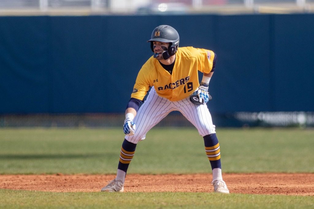 Junior outfielder Jake Slunder watches a pitch while on base. (Photo courtesy of Racer Athletics)