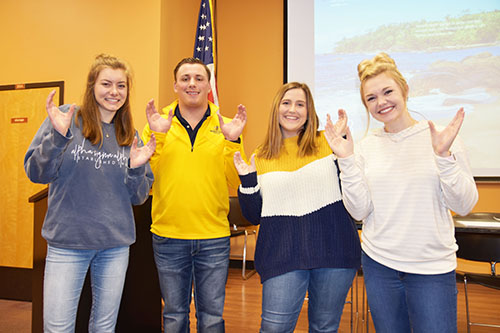 Amy Krazl, Warren Norman, Molly Logsdon and Hannah Daab pose after the SGA administration announcement. (Paige Bold/The News )
