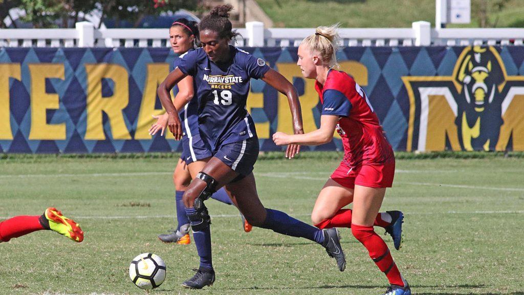 Junior midfielder Symone Cooper pushes the ball upfield in a match from the 2019 season. (Photo courtesy of Racer Athletics)