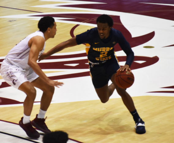 Sophomore guard Chico Carter Jr. drives left against a Saluki defender. (Photo courtesy of Gage Johnson/TheNews)