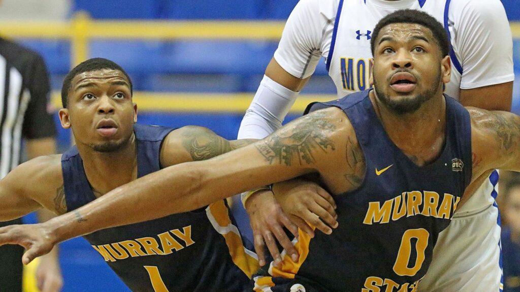 Sophomore forward Demond Robinson and sophomore guard DaQuan Smith block out for a rebound against Morehead State. (Photo courtesy of Racer Athletics)