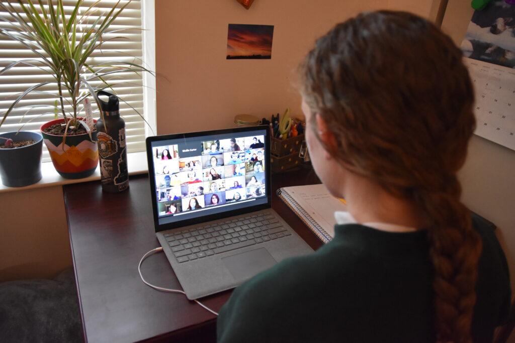 Mollie Carter listens in on her Zoom class from her residential college room. (Jill Rush/The News)