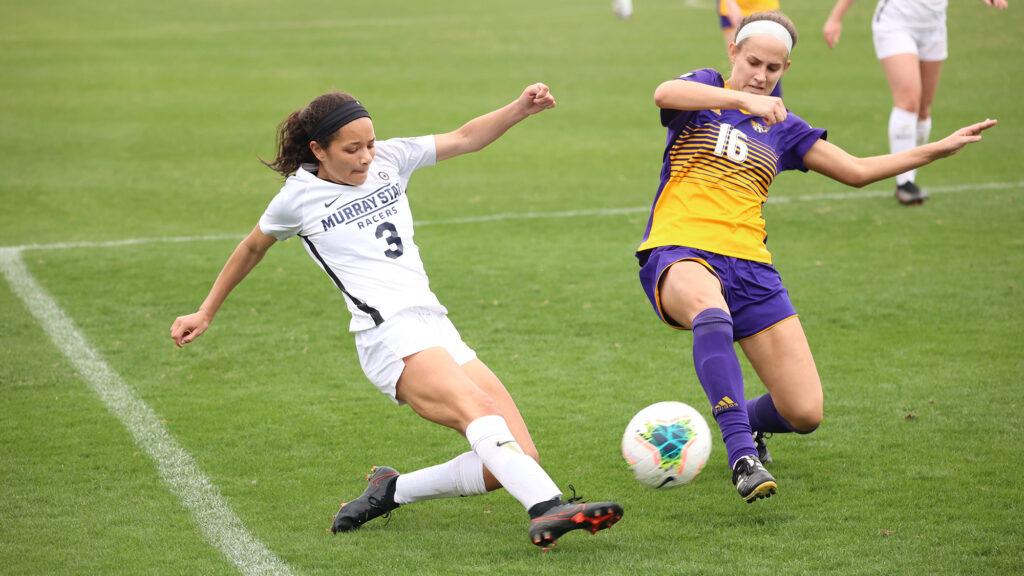 Freshman Camille Barber tries to spur the ball past the defense. (Photo courtesy of David Eaton)