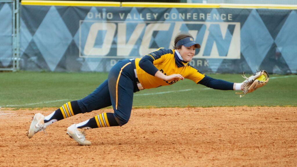 Sophomore infielder Lily Fischer makes a diving stop against SIUE. (Photo courtesy of Piper Cassetto)