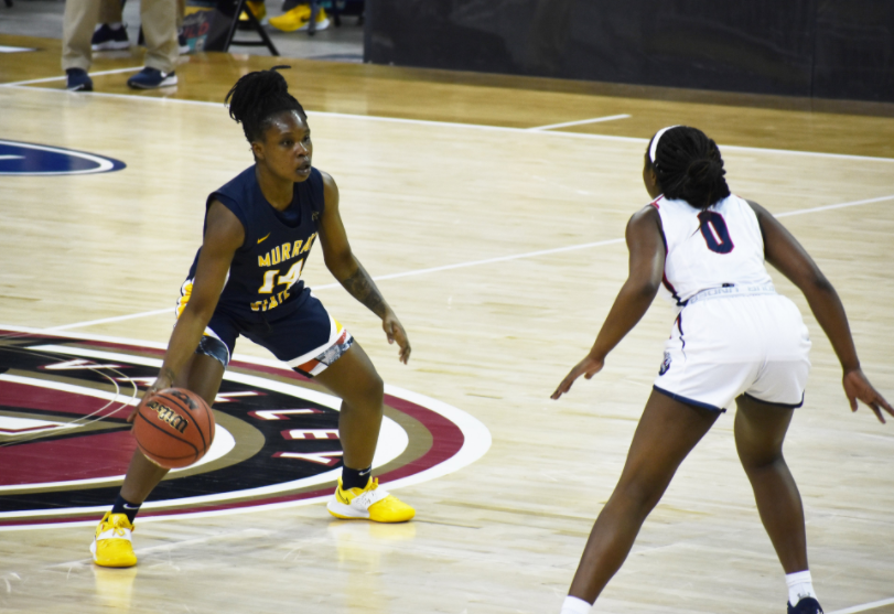 Junior+guard+Manna+Mensah+sizes+up+the+defense+in+the+OVC+Tournament+game+against+Belmont.+%28Photo+courtesy+of+Gage+Johnson%2FThe+News%29
