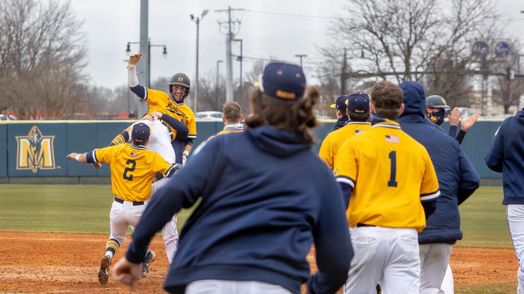 Senior+outfielder+Jake+Slunder+is+mobbed+by+his+teammates+after+hitting+a+walk-off+single+in+the+third+game+of+the+series+against+Purdue+University+Fort+Wayne.+%28Photo+courtesy+of+David+Eaton%29