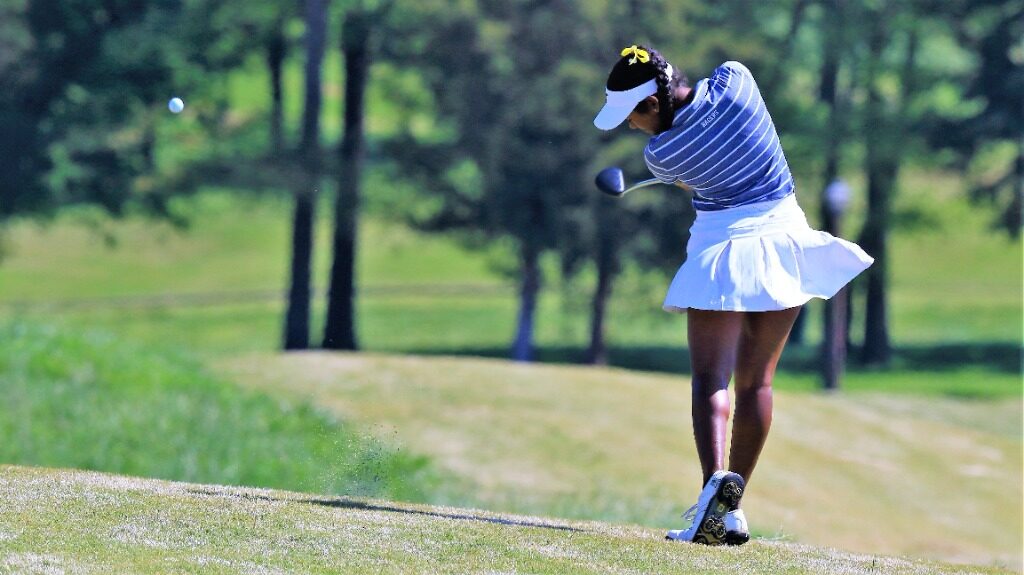 Senior Raeysha Surendran takes a strong swing in the OVC Tournament. (Photo courtesy of Racer Athletics)