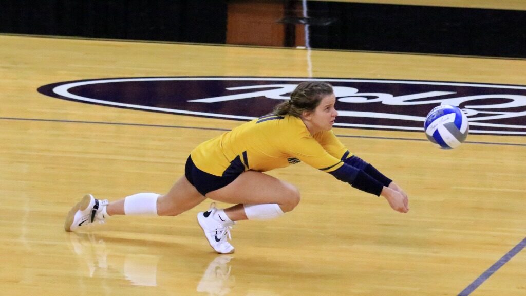 Senior libero Becca Fernandez makes one of her many saves against New Hampshire during the Mercer Bear Classic in Maco, Georgia on Friday, Aug. 27. Photo courtesy of Justin Ertl, Racer Athletics.
