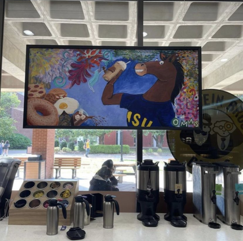 OMAS students’ painting is on display at Einstein Bros Bagels at the Waterfield Library (Photo courtesy of the College of Humanities and Fine Arts Instagram).