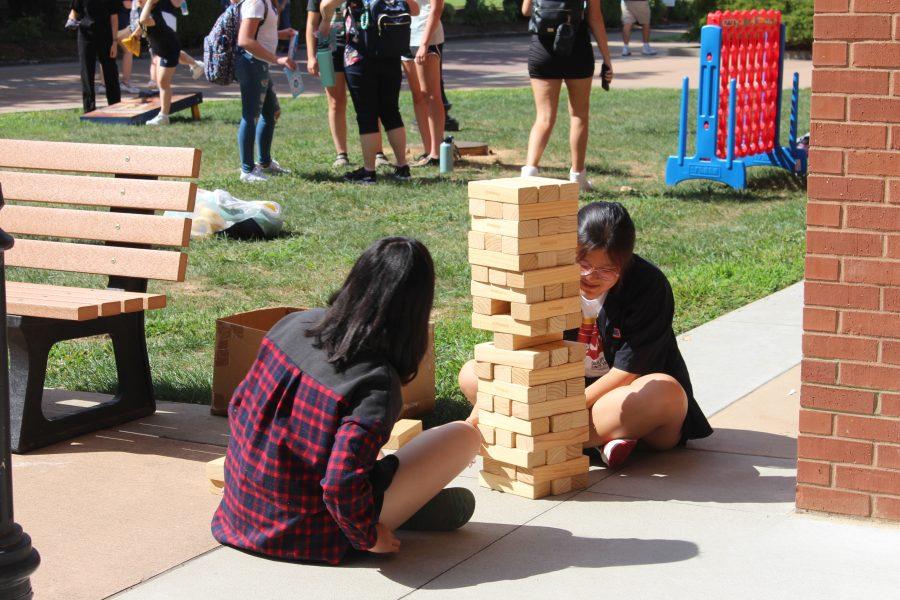 Students play Jenga at the Racers Empower Ice Cream Social hosted on Monday, Aug. 22. 