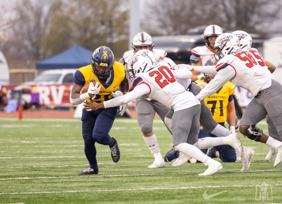 Freshman+running+back+Cortezz+Jones+breaks+a+tackle+on+his+way+one+of+his+two+touchdowns+against+Robert+Morris.+Photo+courtesy+of+Racer+Athletics.