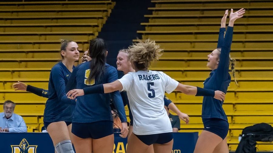 Graduate+middle+blocker+%28left%29+Elisa+Dozio+gets+congratulated+after+a+block+against+the+Beacons.+Photo+courtesy+of+Racer+Athletics.