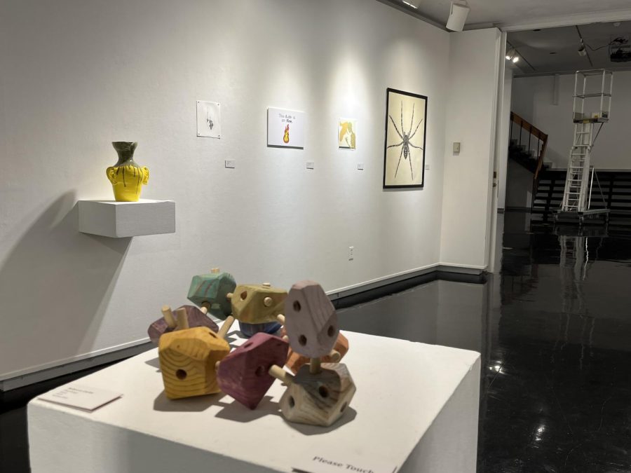 Six pieces of art from the Professional Blend XIII exhibit on display in the Mary Ed Mecoy Hall Gallery. (Raleigh Hightower/The News)
