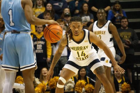 Sophomore guard Brian Moore breaks down on defense against an Indiana State defender. Moore is averaging 8.5 points per game this season, including a career high against Belmont. Photo by Rebeca Mertins Chiodini/The News.