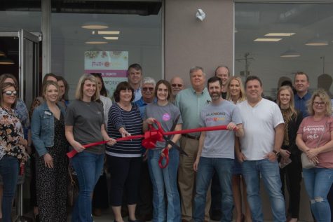 Gregory and Avery Barnes stand alongside friends, family and investors at the grand opening of Frutta Bowls and Saladworks on March 1. (Emma Fisher/The News) 