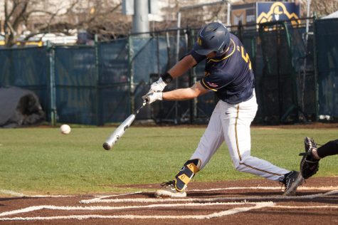 Junior outfielder Cade Sammons hits a single to bring junior infielder Drew Vogel home, giving the Racers a 1-0 lead. The Racers defeated the Northern Alabama Lions 9-6 on Tuesday, March 14. Photo by Rebeca Mertins Chiodini/The News.
