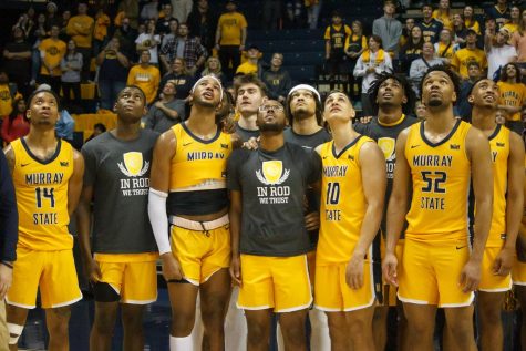 Murray State players huddle around to watch a Senior Night video on the jumbotron following their victory over Valparaiso on Sunday, Feb. 26. Photo by Rebeca Mertins Chiodini/The News.