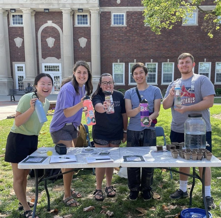 Members of the Earth Project tabling outside of Carr Hall to educate students on the environmental benefits of reusable water bottles. (Photo courtesy of @theearthproject_23 on Instagram)