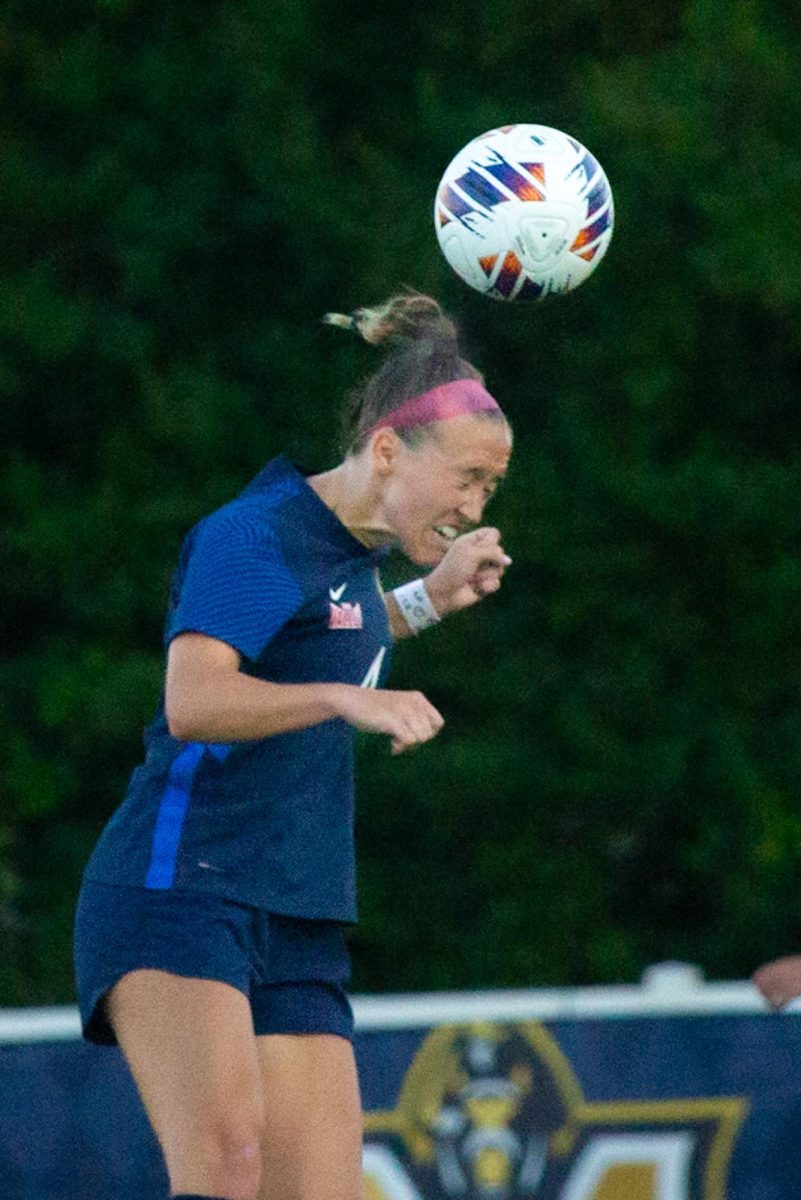 Graduate defender Saraya Young heads a ball towards the goal against Grambling State University.