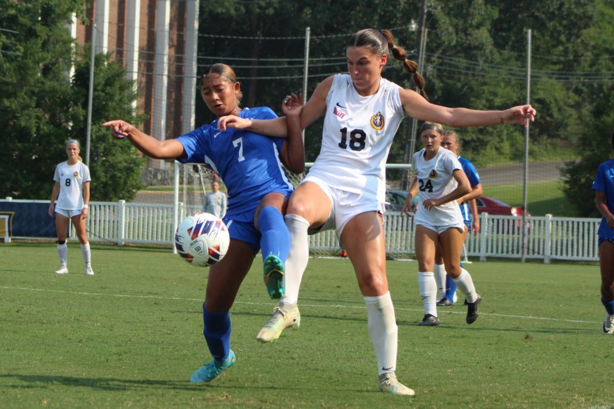 Sophomore forward Sydney Etter fights for possession of the ball. 