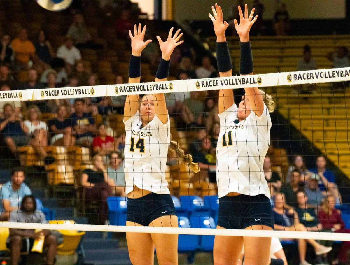 Freshman middle blocker Lily Burnett goes to block a shot against Evansville.