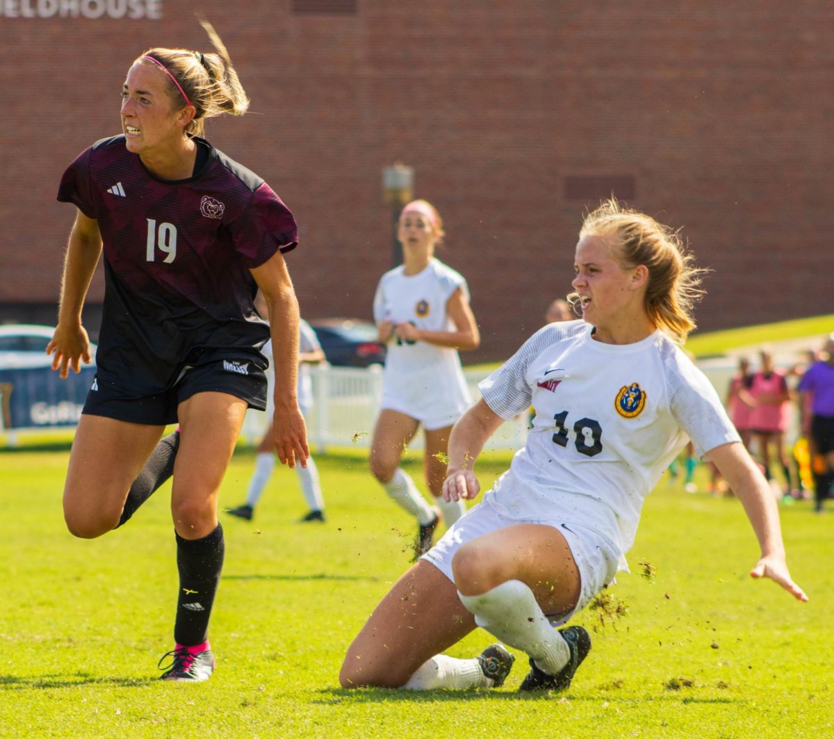 Sophomore midfielder Mary Hardy slides after making a pass. 