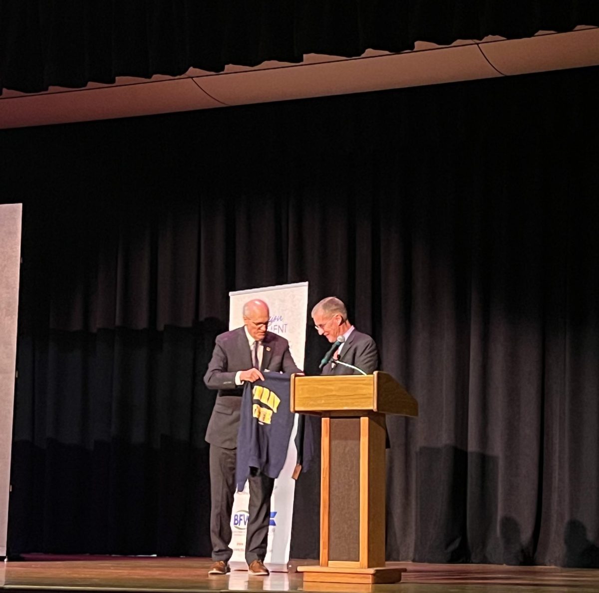 University President Bob Jackson presents a Murray State sweatshirt to guest speaker, retired Army Gen. Stan McChrystal.