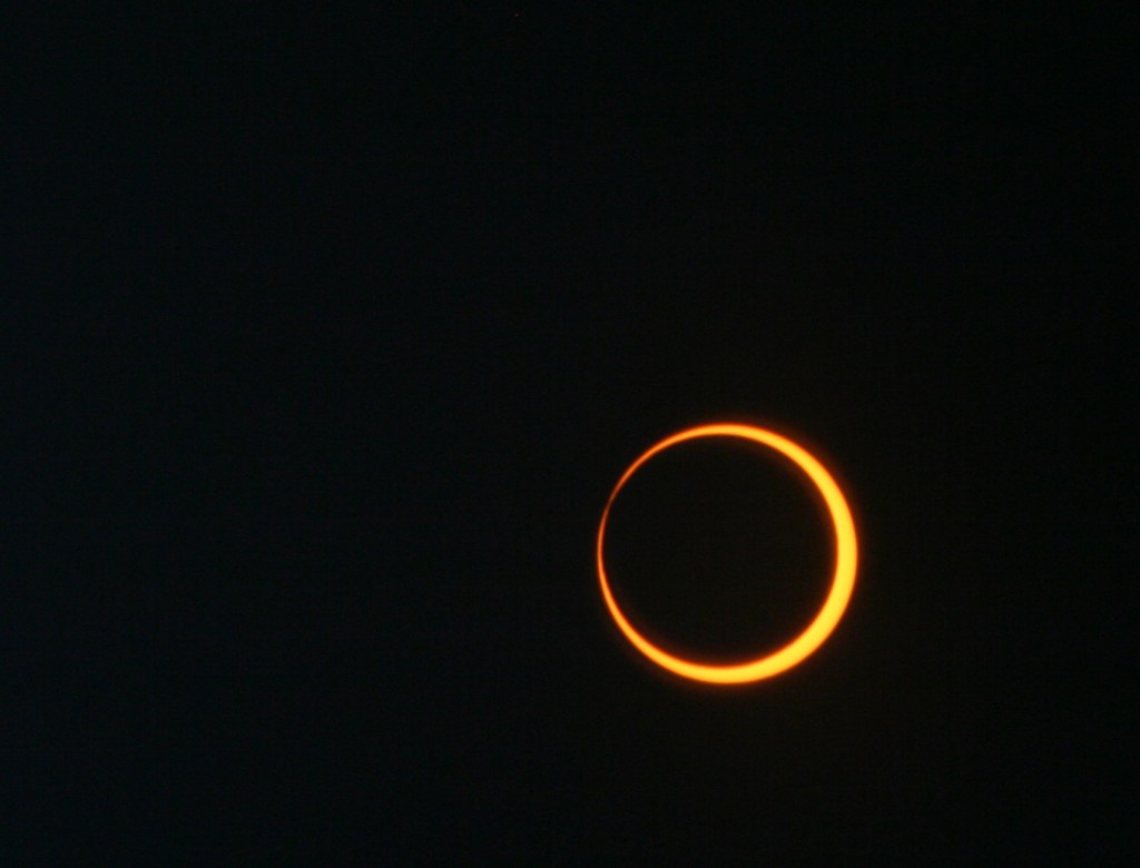 An annular solar eclipse occurs when the Moon passes  through the Sun and Earth while it’s the farthest from Earth.   