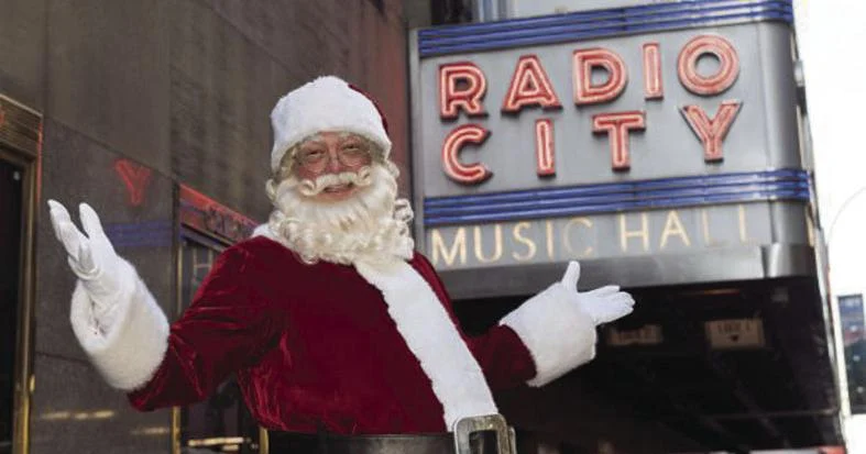 Hall outside of Radio City in his Santa costume. Photo courtesy of Charles Edward Hall. 
