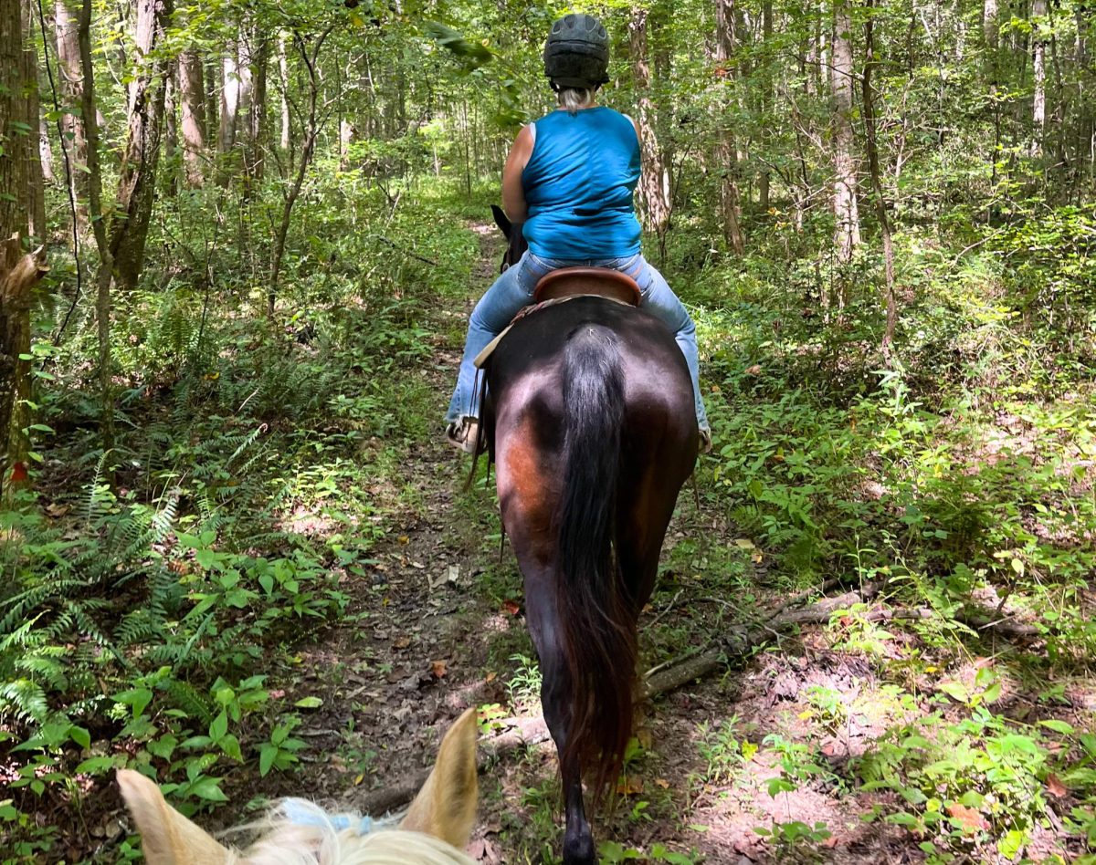 Finley and her mother horseback ridinf at Natchez Trail. 