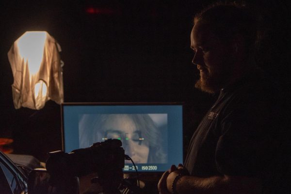 Director Zackary Claggett stands behind camera during filming of Scene 10. Photo by Sam Mitchell.